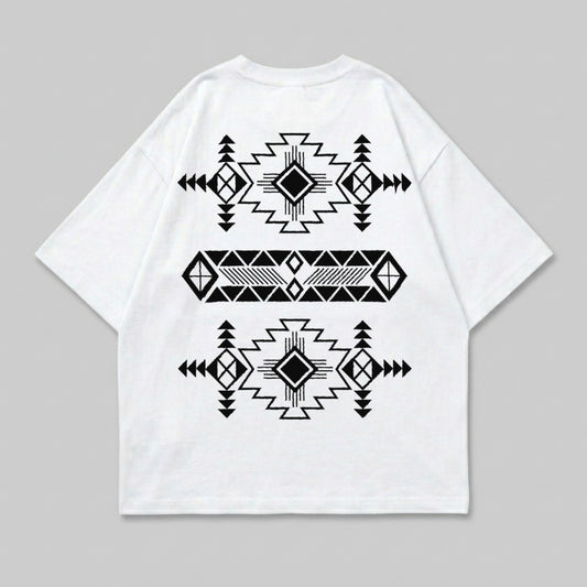 White t-shirt with black geometric Native American-inspired pattern on back.