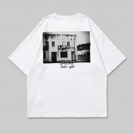 White t-shirt with black and white photograph of a motel and text.