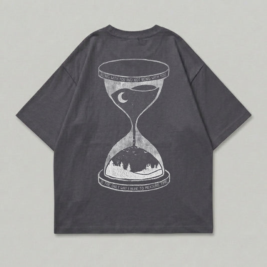 Dark gray t-shirt with hourglass graphic and text: "Being with you and not being with you is the only way I have to measure time."