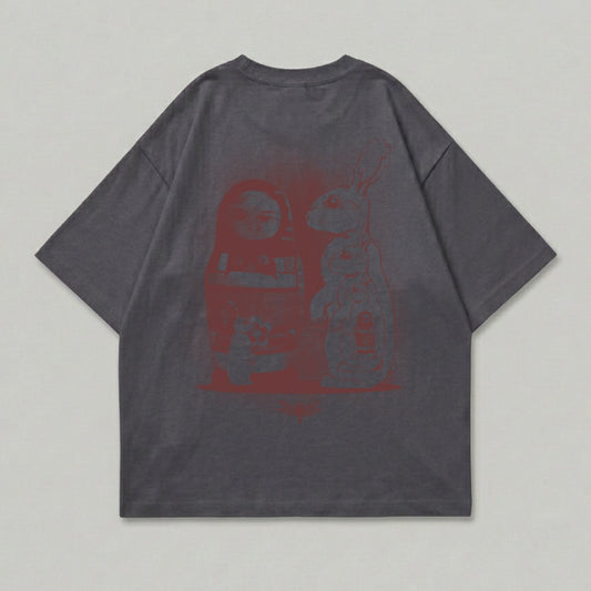 Grey t-shirt with red graphic of a matryoshka doll and a rabbit.