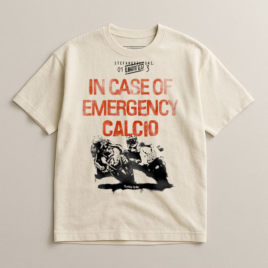 Cream t-shirt with "IN CASE OF EMERGENCY CALCIO" and two football players.
