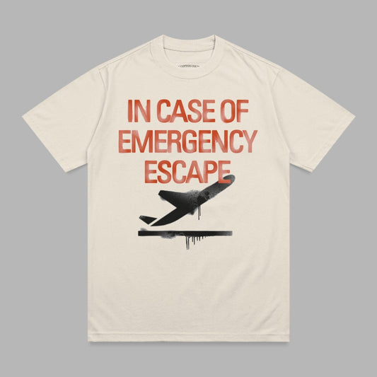 Cream t-shirt with "IN CASE OF EMERGENCY ESCAPE" text and a black airplane graphic.