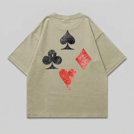 Beige t-shirt with playing card suits graphic on back.