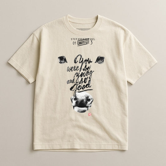 Cream t-shirt with stylized eyes, nose, and text "You were so young and so good."