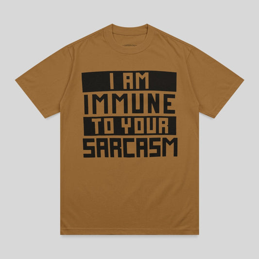 Brown t-shirt with black text reading "I AM IMMUNE TO YOUR SARCAST."