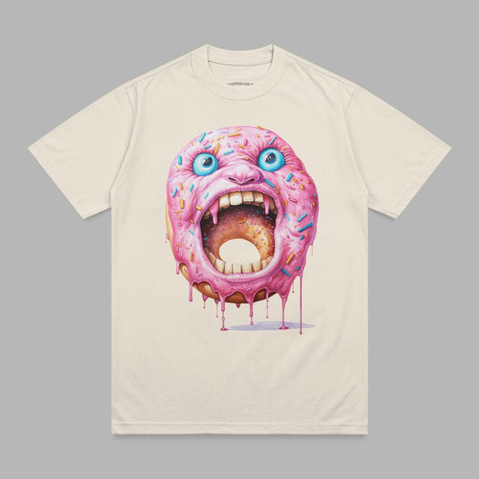 Cream t-shirt with a screaming pink frosted donut with blue sprinkles and red dripping icing.