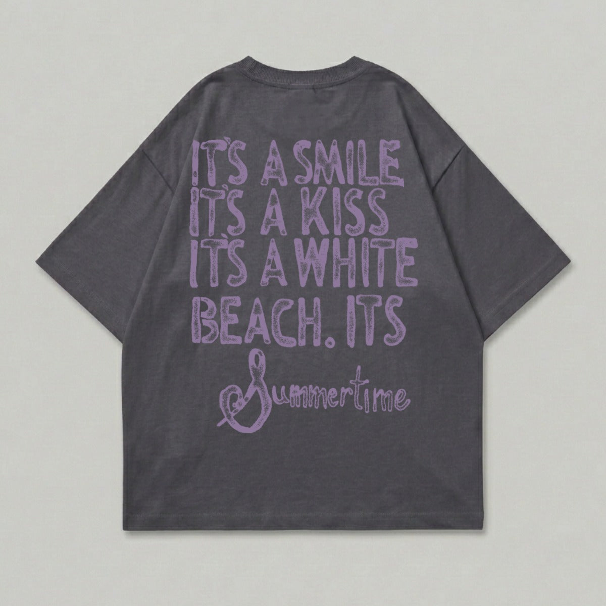 Dark grey t-shirt with "It's a smile, it's a kiss, it's a white beach. Summertime" text.
