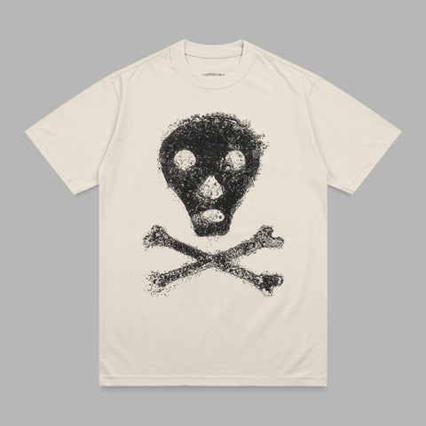 Cream t-shirt with distressed black skull and crossbones graphic.