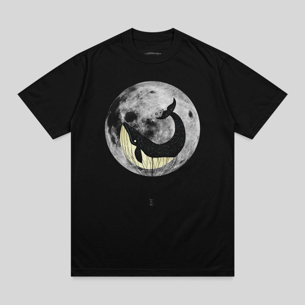 Black t-shirt with a whale in a hot air balloon against a full moon.