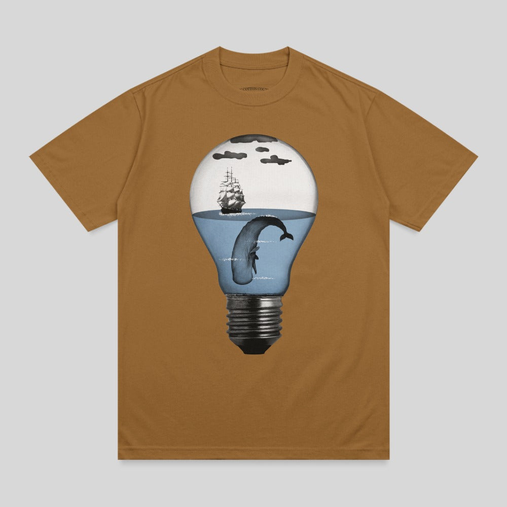 Brown t-shirt with a lightbulb graphic featuring a whale and ship.