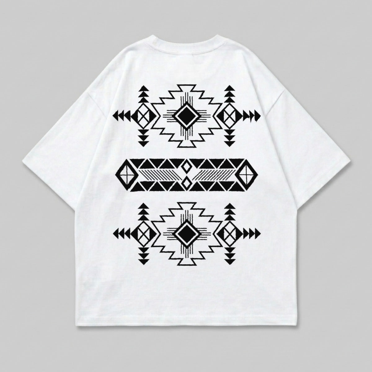 White t-shirt with black geometric Native American-inspired pattern on back.
