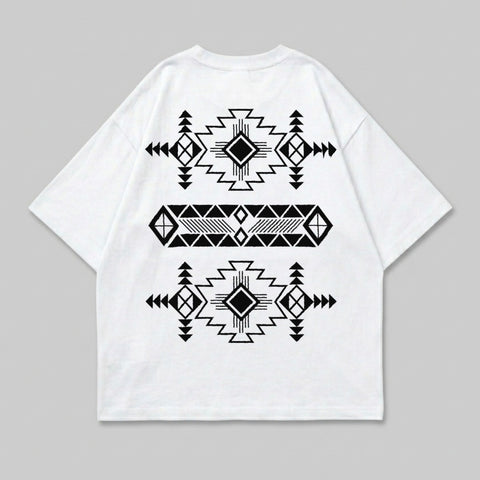 White t-shirt with black geometric Native American-inspired pattern on back.