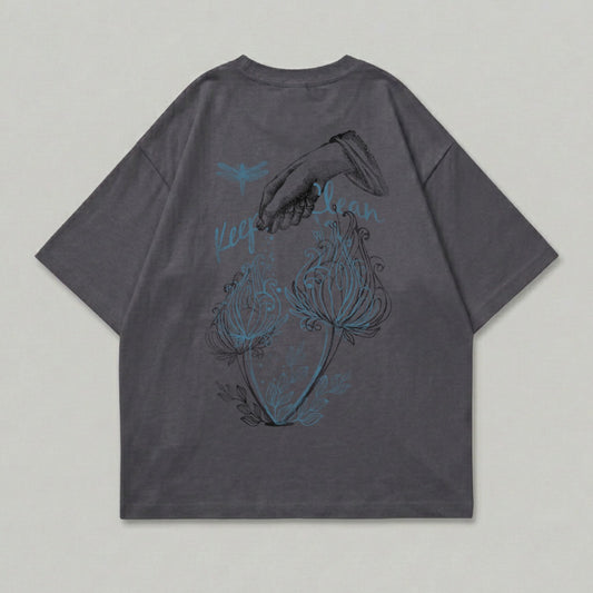 Dark gray t-shirt with dragonfly, hand sprinkling flowers, and "Keep Calm" text.