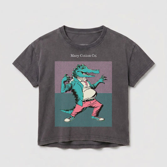 Anthropomorphic alligator in a suit and tie, standing with hands on hips.