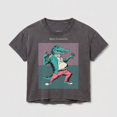 Anthropomorphic alligator in a suit and tie, standing with hands on hips.