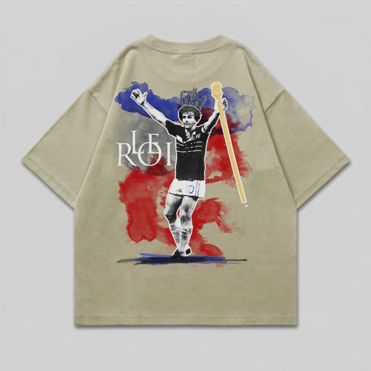 T-shirt with a graphic of a soccer player wearing a crown and holding a scepter.