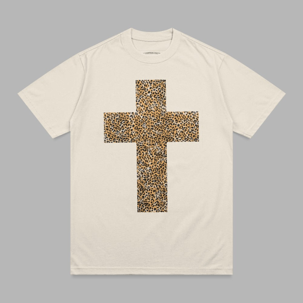 Cream t-shirt with a large leopard print cross graphic on the front.