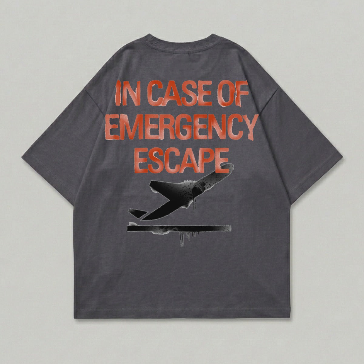 Dark gray t-shirt with "IN CASE OF EMERGENCY ESCAPE" and airplane graphic.