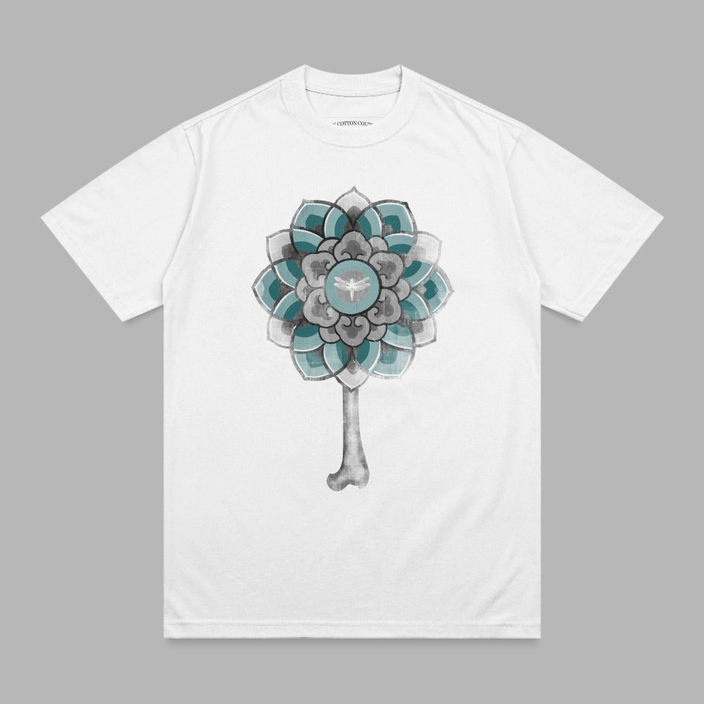 White t-shirt with a teal and gray floral key design.