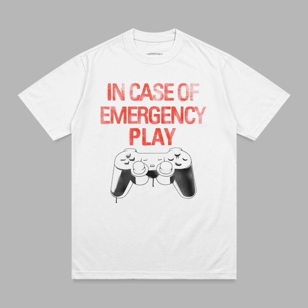 White t-shirt with red "In Case of Emergency Play" text and controller graphic.