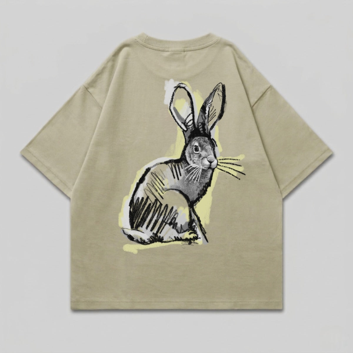 Beige t-shirt with a sketched rabbit graphic on the back.