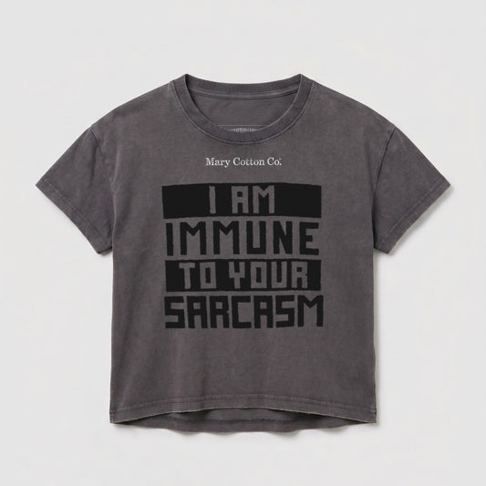 Dark grey t-shirt with "I AM IMMUNE TO YOUR SARCASM" text.