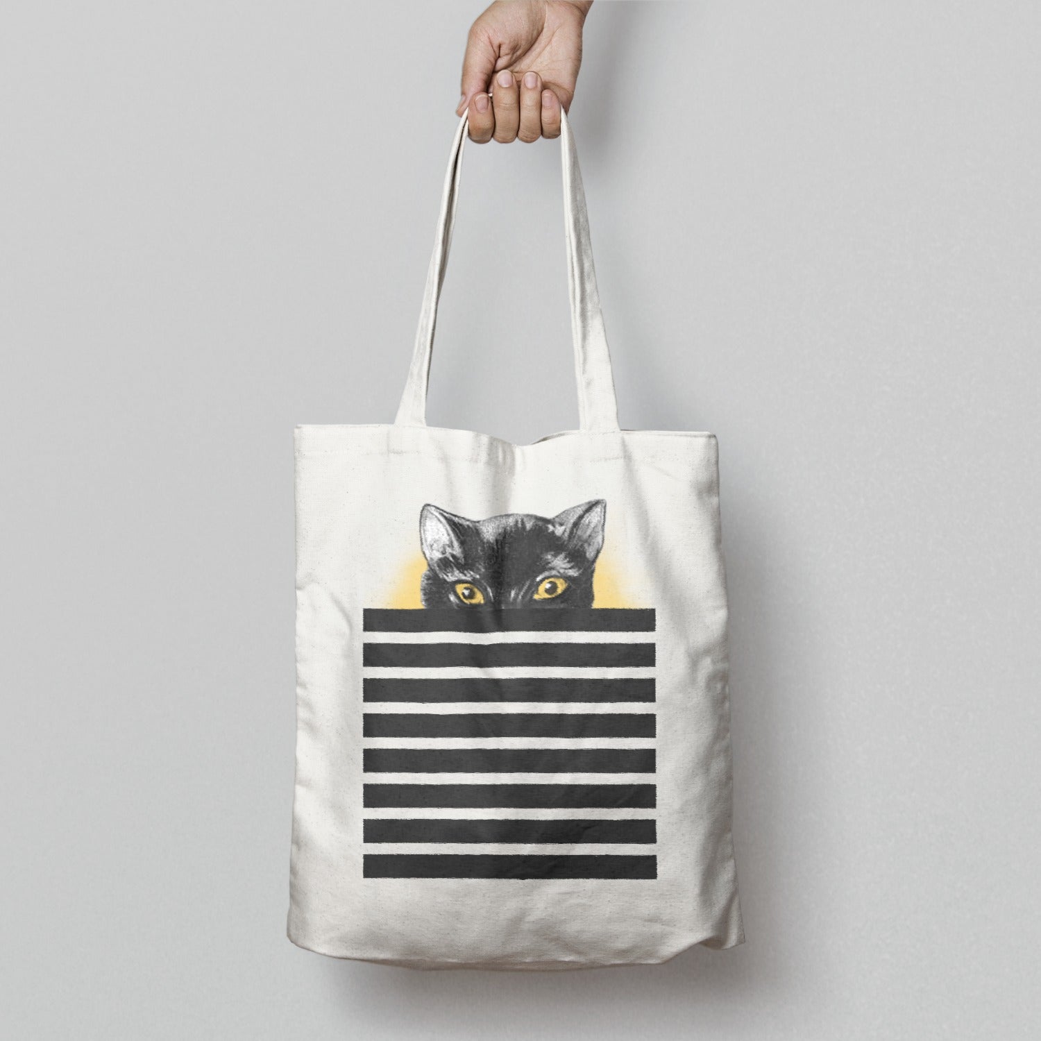 Black Cat Peeking Over Stripes Tote Bag product