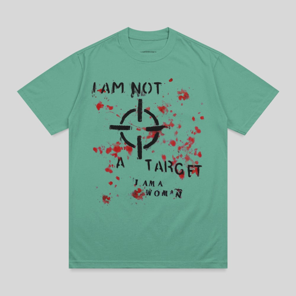 Green t-shirt with a target graphic and "I AM NOT A TARGET. I AM A WOMAN." text.