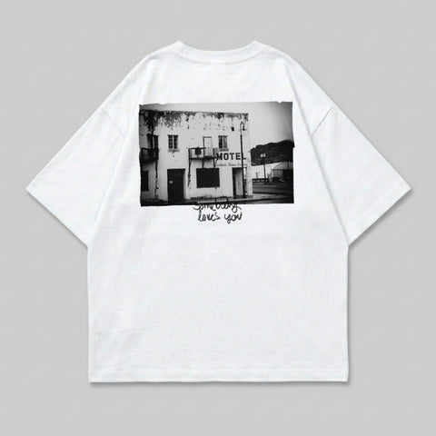 White t-shirt with black and white photograph of a motel and text.