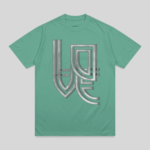 Green t-shirt with metallic silver geometric design in the center.