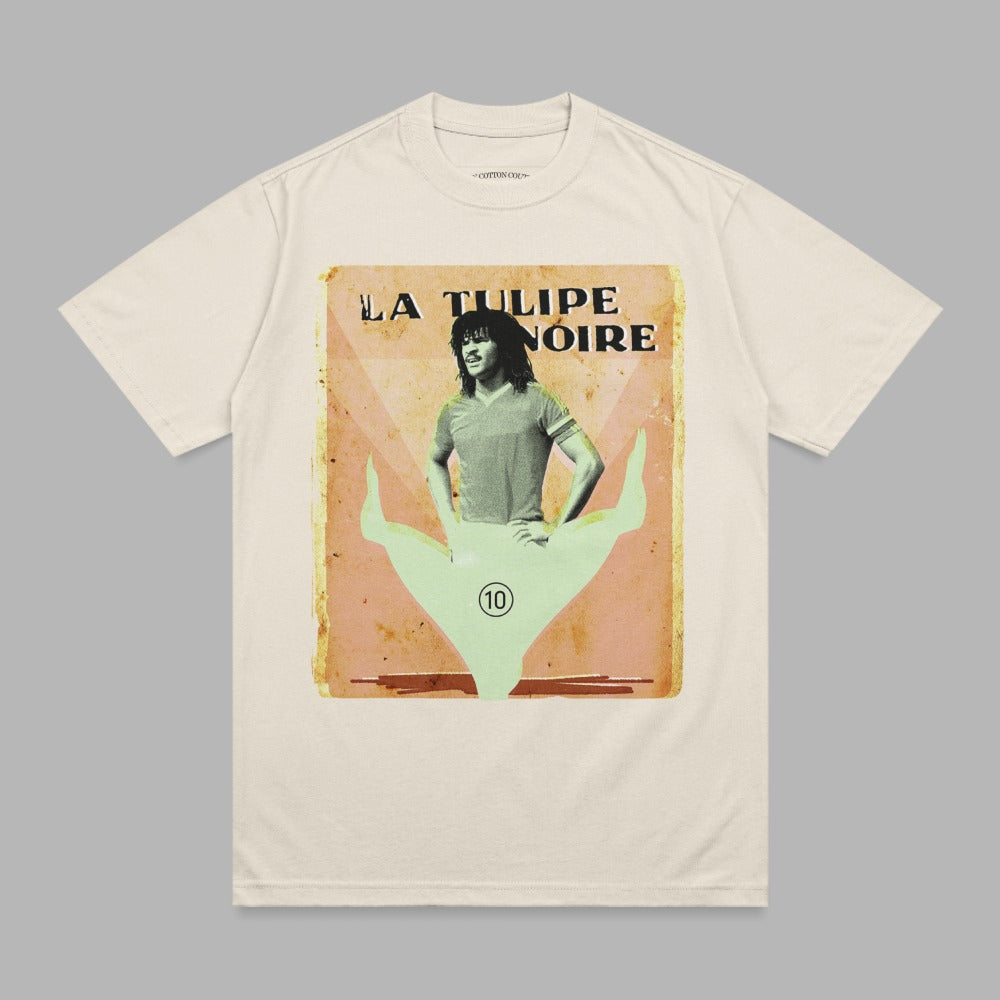 T-shirt with vintage poster graphic of a person in a split, "LA TULIPE NOIRE" text.