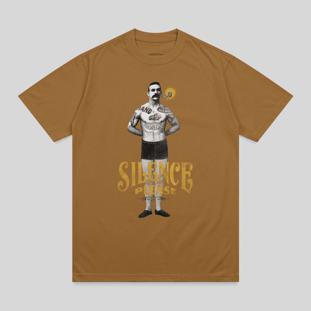 Man with pipe and band t-shirt with "SILENCE PLEASE" text.