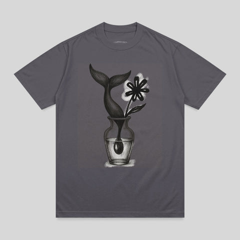 Gray t-shirt featuring a drawing of a whale's tail and flower in a vase.