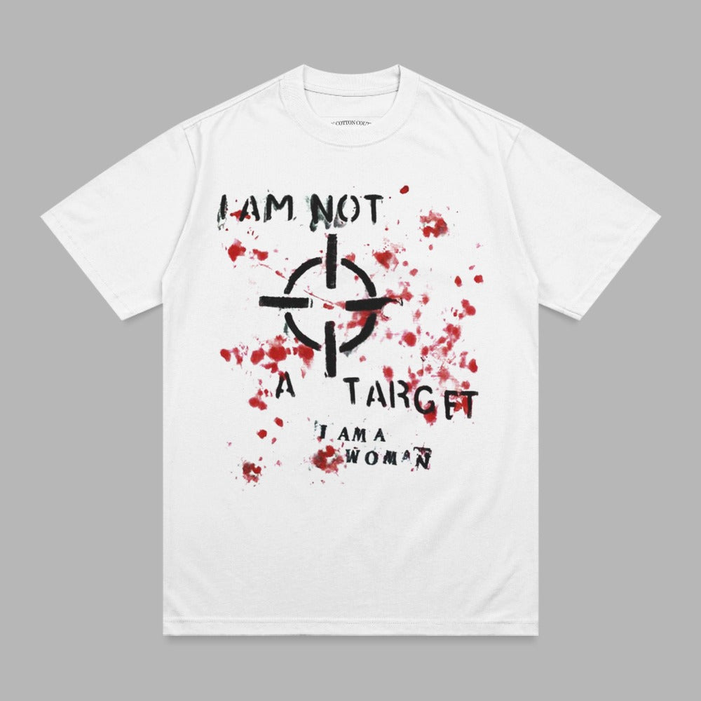 White t-shirt with black bullseye and red paint splatter; text reads "I AM NOT A TARGET I AM A WOMAN".