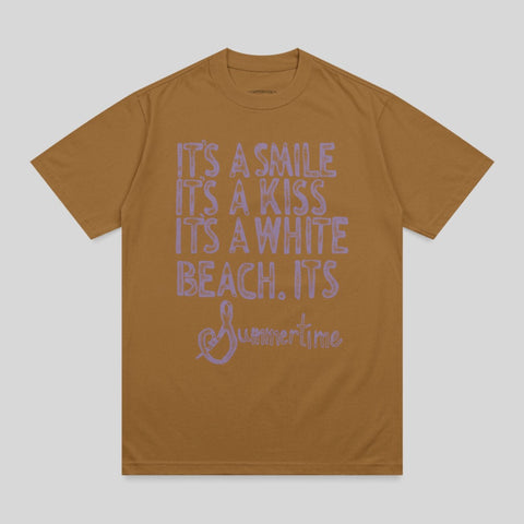 Brown t-shirt with light purple text: "It's a smile, it's a kiss, it's a white beach. It's Summertime."