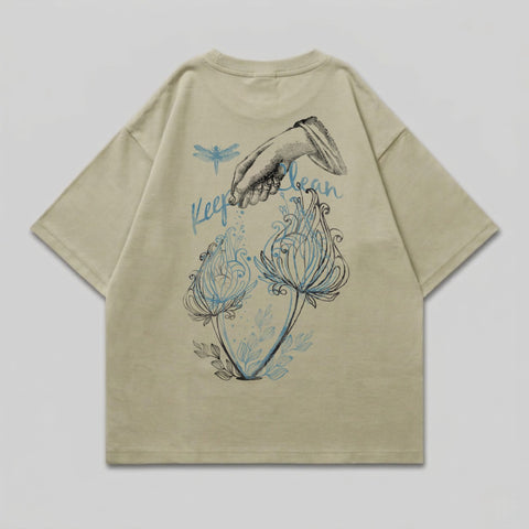 Light tan t-shirt with dragonfly and floral design.