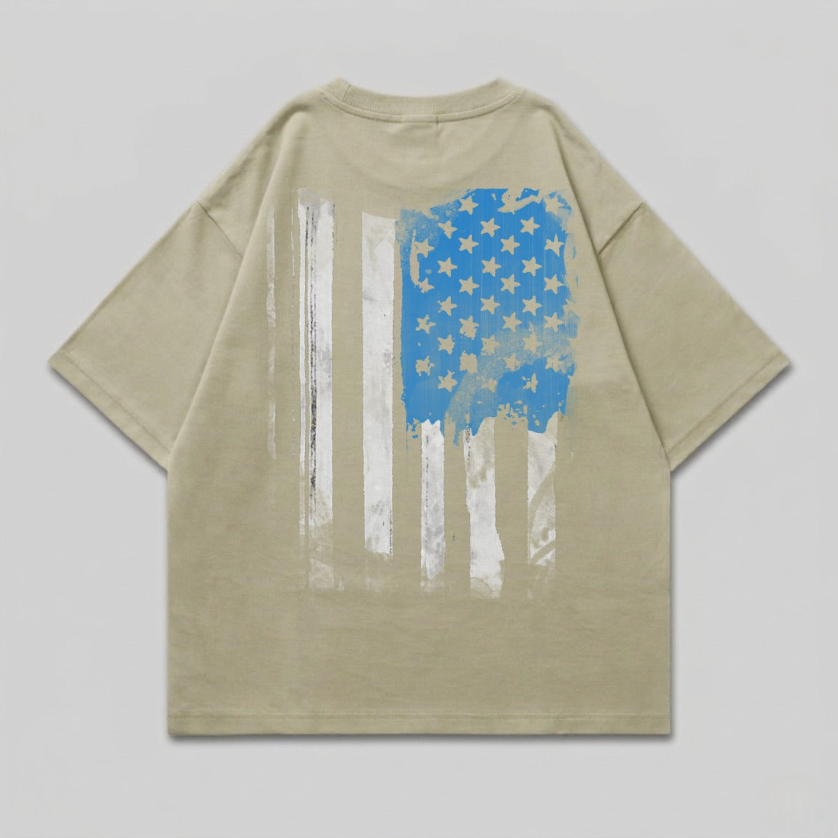 Tan t-shirt with distressed American flag graphic on back.