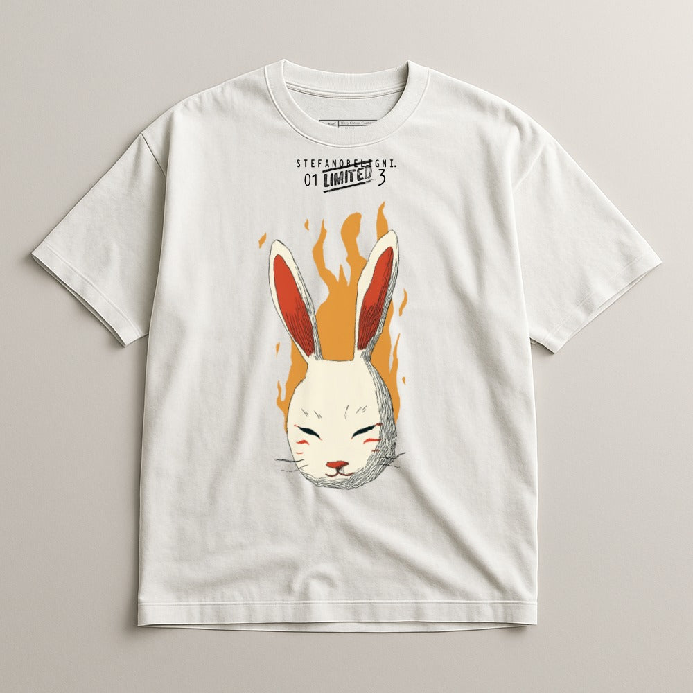 White t-shirt with a stylized white bunny mask with orange accents and flames.
