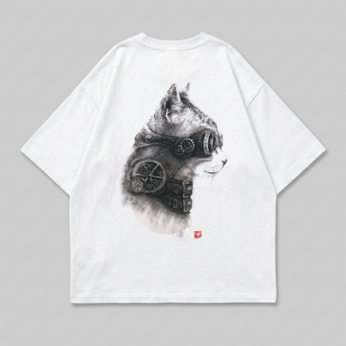 White t-shirt with detailed steampunk cat graphic wearing goggles.