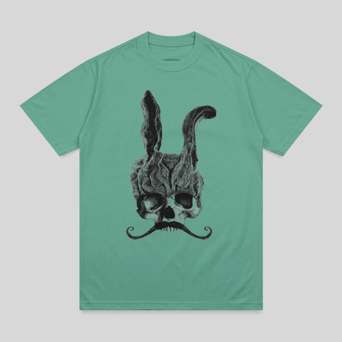 Skull with bunny ears and a mustache on a teal t-shirt.