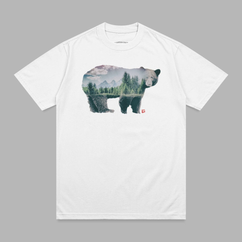White t-shirt with double exposure graphic of a bear and forest landscape.