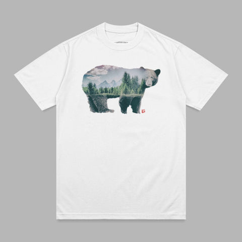 White t-shirt with double exposure graphic of a bear and forest landscape.