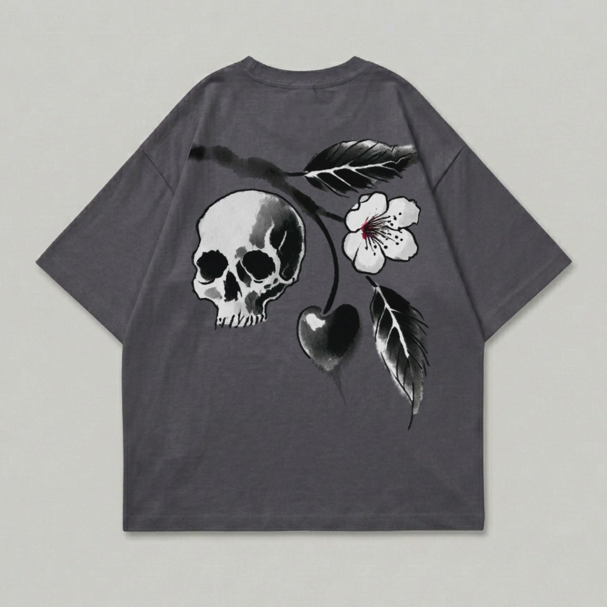 Dark grey t-shirt with skull, cherry, and flower graphic on back.