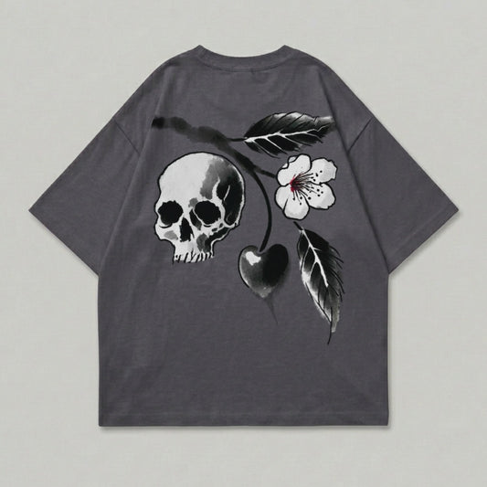 Dark grey t-shirt with skull, cherry, and flower graphic on back.