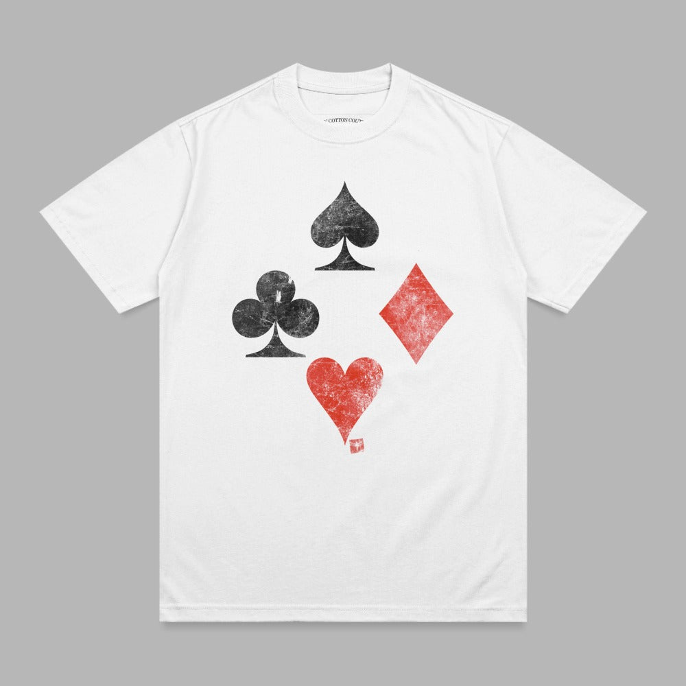 White t-shirt with large black spades, clubs, diamonds, and red heart card suits.