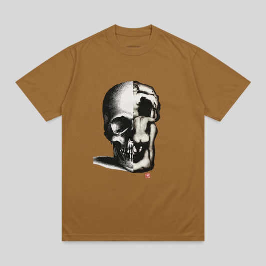 Brown t-shirt with a black and white illustration of a skull merging with a distorted face.