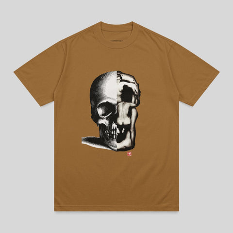 Brown t-shirt with a black and white illustration of a skull merging with a distorted face.