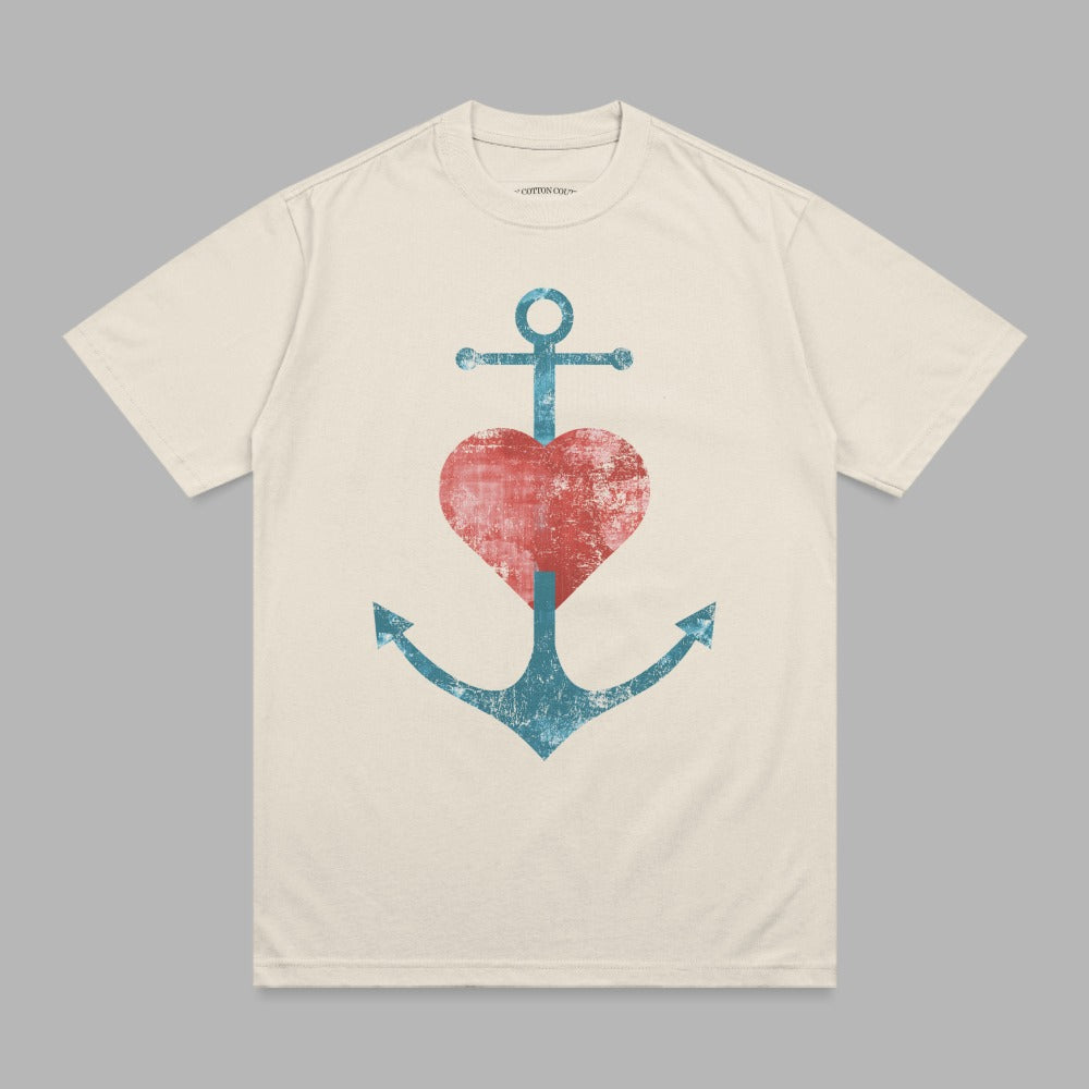 Cream t-shirt with distressed anchor and heart graphic.