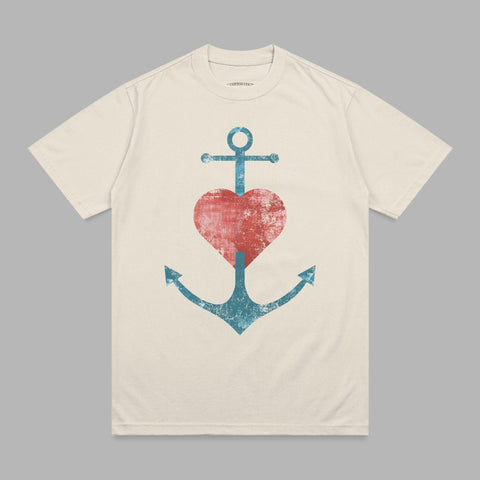 Cream t-shirt with distressed anchor and heart graphic.