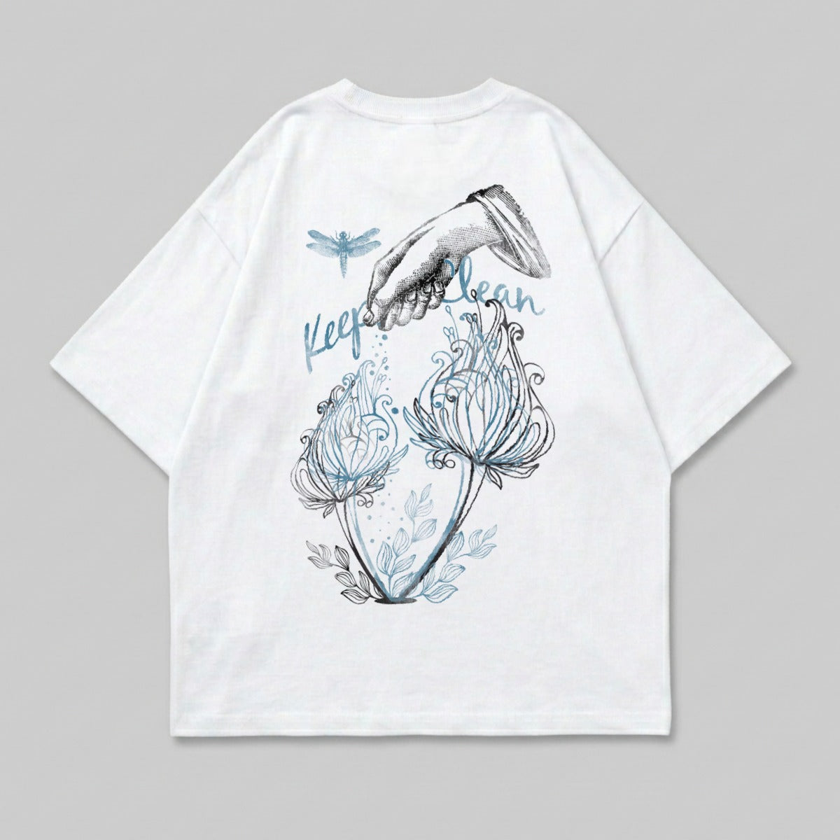 White t-shirt with dragonfly and hand watering plants graphic.